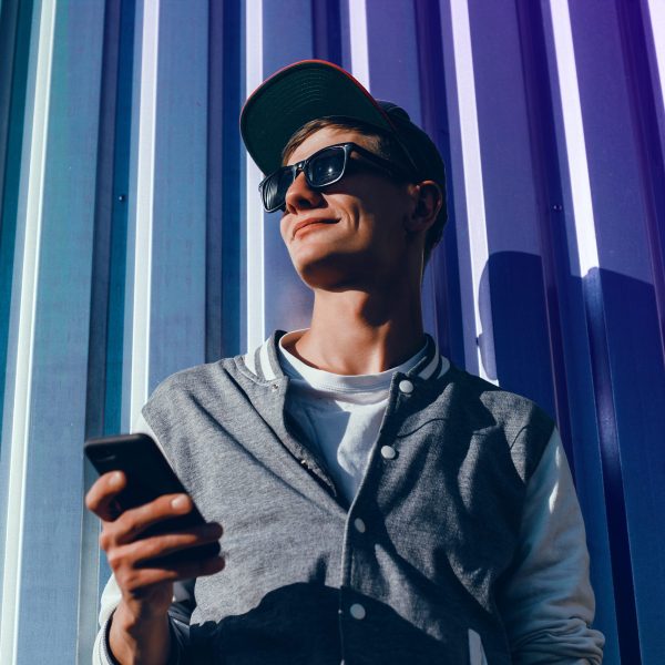 young man holding a smartphone